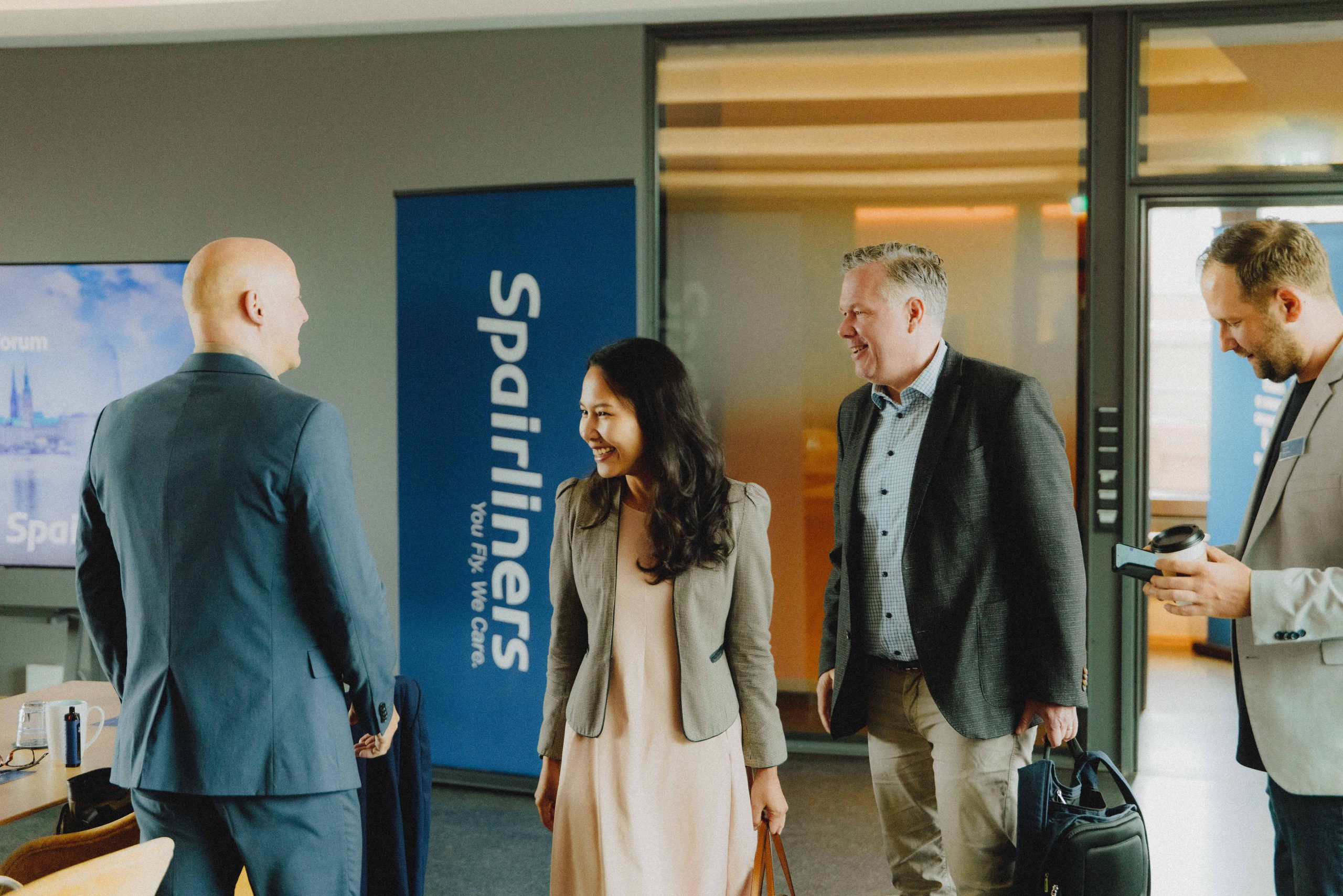 Group of aviation professionals networking at the Spairliners Operators Forum in Hamburg
